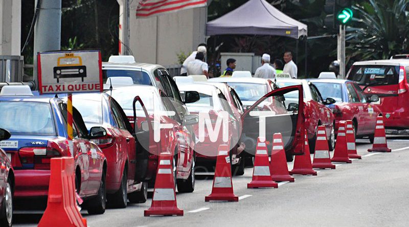 Putrajaya’s requirements for Grab won’t help cabbies, says coalition