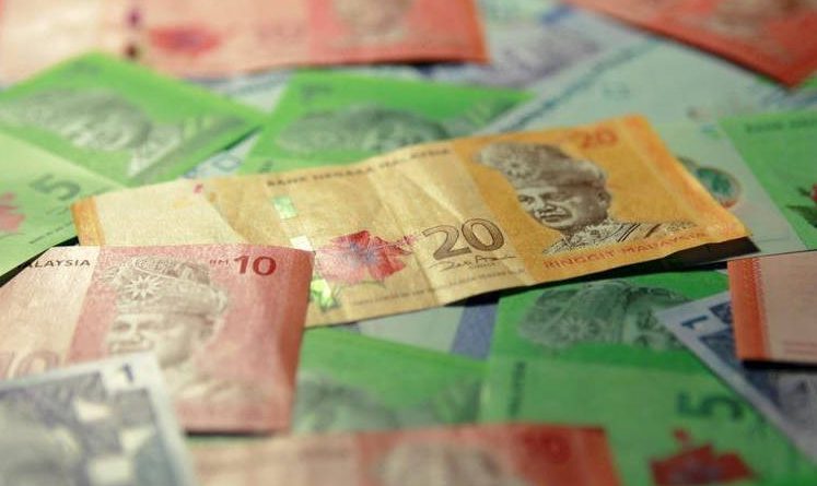 Ringgit halts 2-day loss as oil extends advance
